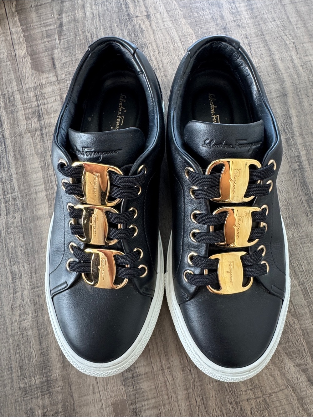 Salvatore Ferragamo Black Leather Sneakers with Gold Accents